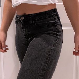 Black skinny jeans (ripped in knees)